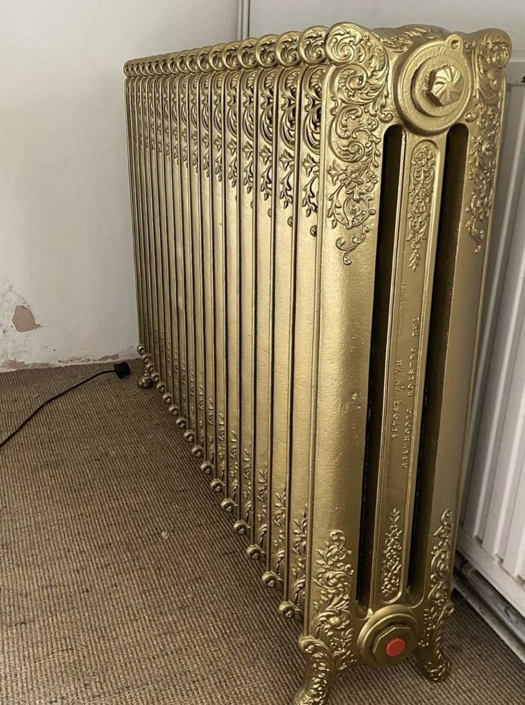 Ornate gold painted cast iron column radiator